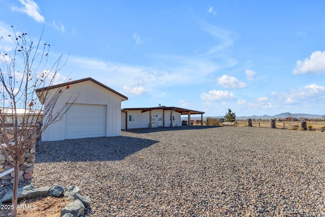 exterior space with a mountain view and a garage