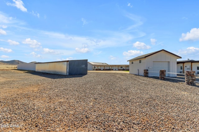 view of yard with a garage and an outdoor structure