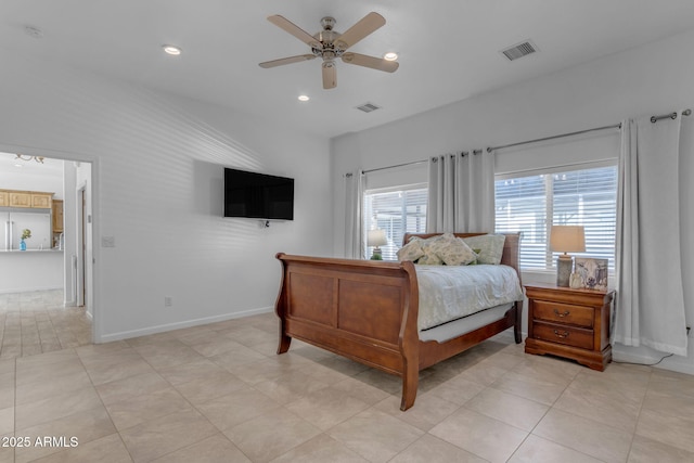 tiled bedroom with ceiling fan and multiple windows