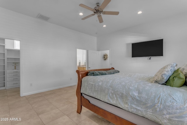 bedroom featuring light tile patterned flooring, a closet, ceiling fan, and a spacious closet