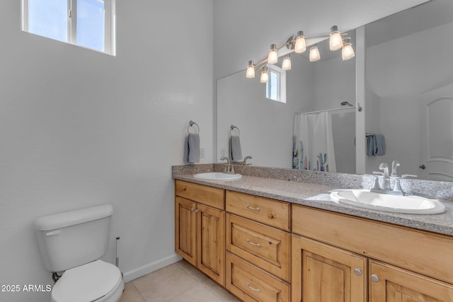 bathroom featuring toilet, tile patterned floors, walk in shower, and vanity