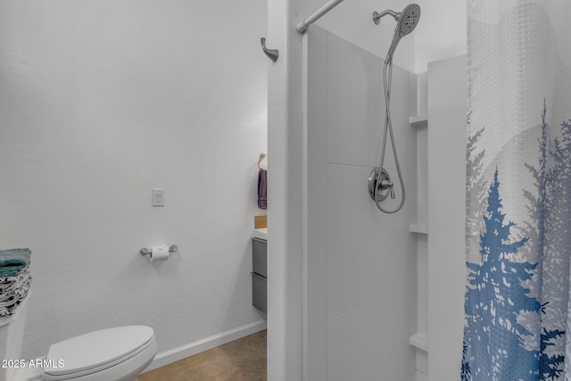 bathroom with walk in shower, tile patterned flooring, vanity, and toilet