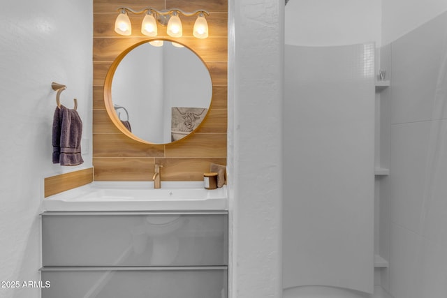 bathroom with vanity and tasteful backsplash