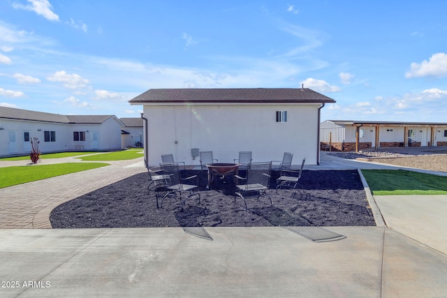 view of patio featuring a fire pit