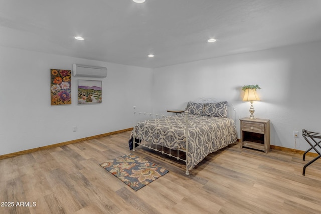 bedroom featuring a wall mounted AC and wood-type flooring