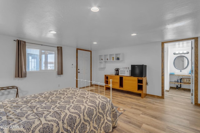 bedroom with light hardwood / wood-style floors