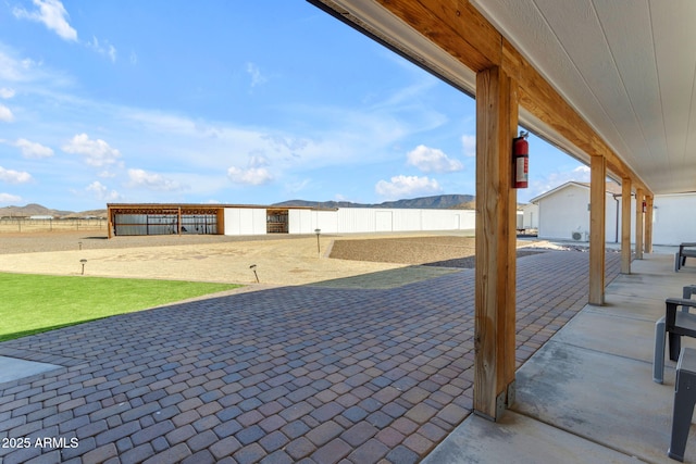 view of patio / terrace featuring a mountain view