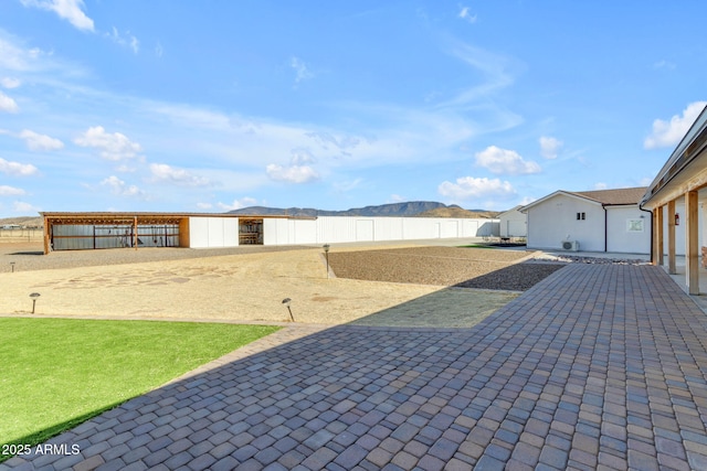 view of patio / terrace with a mountain view