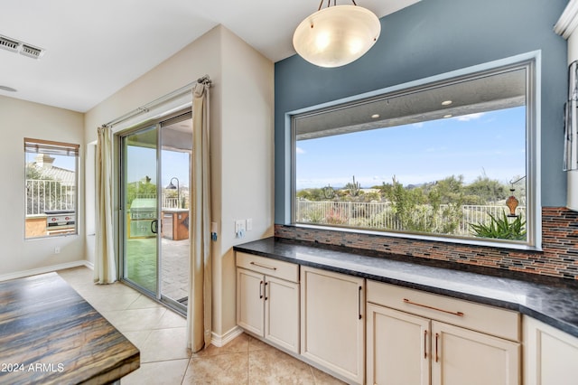 bathroom with tile patterned floors and decorative backsplash