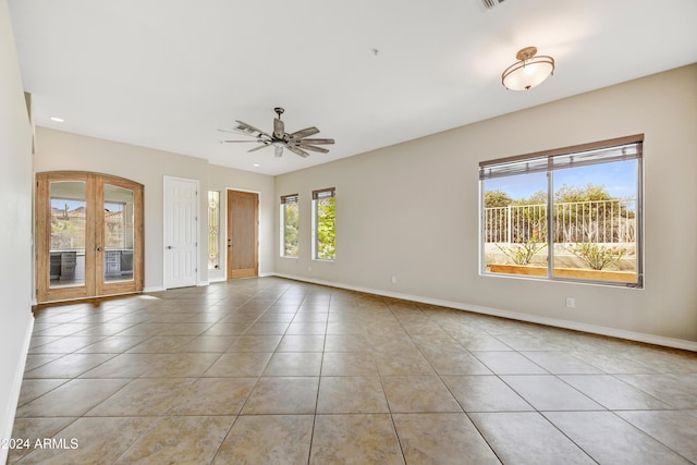 tiled empty room with ceiling fan