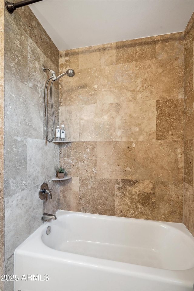 full bath featuring shower / bathtub combination