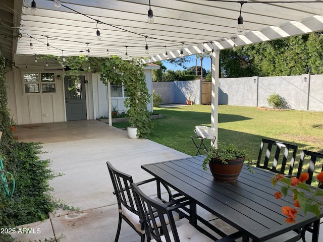 view of patio with outdoor dining space and a fenced backyard