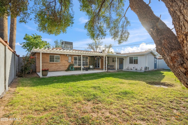 rear view of house with a lawn, a fenced backyard, central air condition unit, a patio area, and a pergola