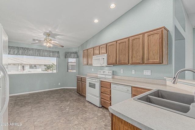 kitchen with ceiling fan, a sink, white appliances, light countertops, and lofted ceiling