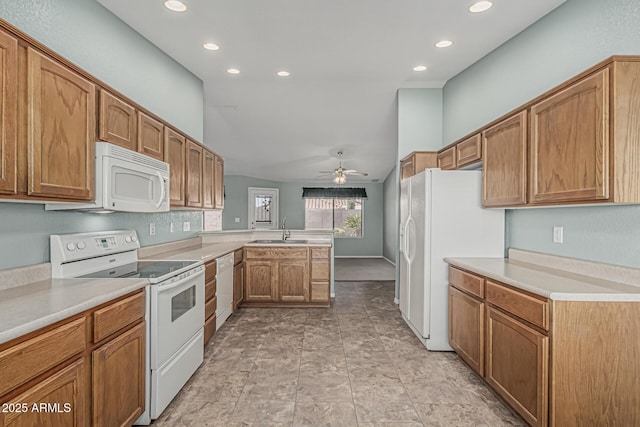 kitchen featuring a sink, a peninsula, white appliances, recessed lighting, and a ceiling fan