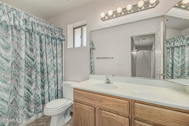 bathroom featuring vanity, a textured wall, toilet, and a shower with curtain