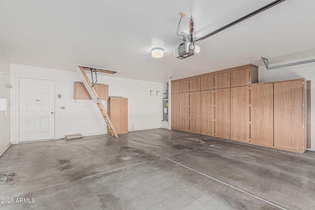 garage with water heater and a garage door opener