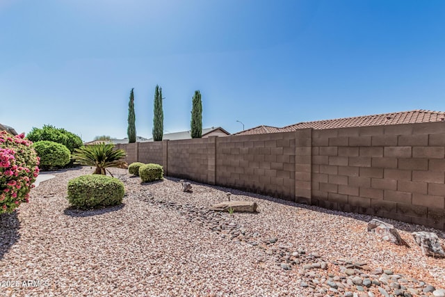 view of yard featuring a fenced backyard