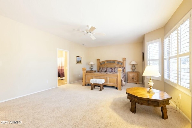 bedroom featuring multiple windows, carpet, and baseboards