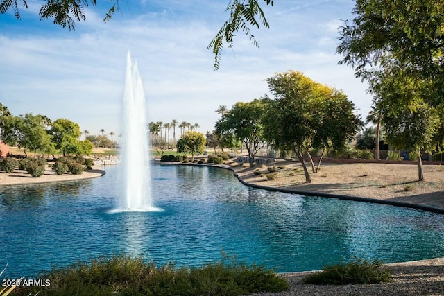 view of pool with a water view