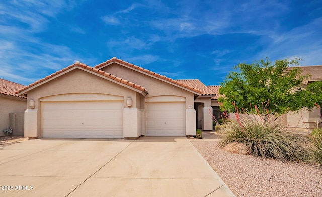 22026 N 44th Pl, Phoenix, AZ 85050 - view of front facade with a tiled roof, a garage, stucco siding, and driveway