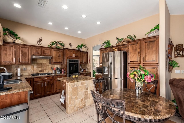 22026 N 44th Pl, Phoenix, AZ 85050 - kitchen featuring tasteful backsplash, a sink, under cabinet range hood, stainless steel appliances, and light tile patterned flooring