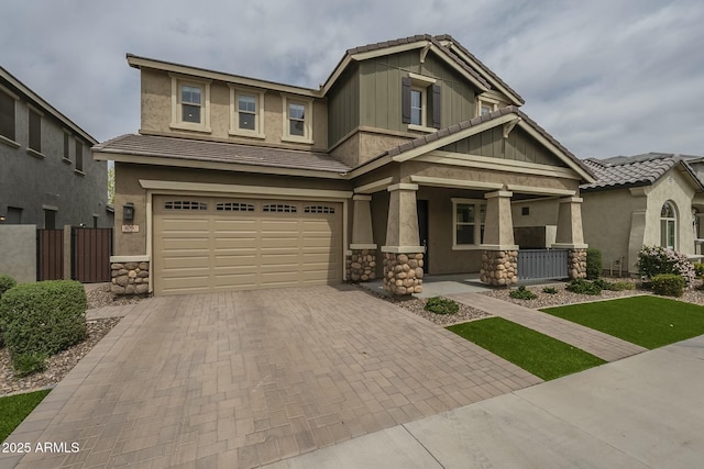 4090 E Bethena St, Gilbert, AZ 85295 - craftsman inspired home with stone siding, stucco siding, a garage, decorative driveway, and a porch