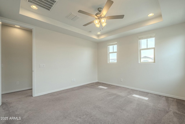 4090 E Bethena St, Gilbert, AZ 85295 - empty room featuring baseboards, a tray ceiling, visible vents, and a ceiling fan