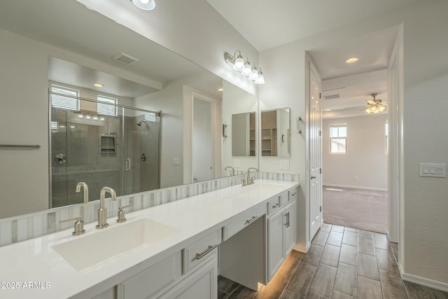 4090 E Bethena St, Gilbert, AZ 85295 - bathroom featuring visible vents, ceiling fan, a sink, and a stall shower