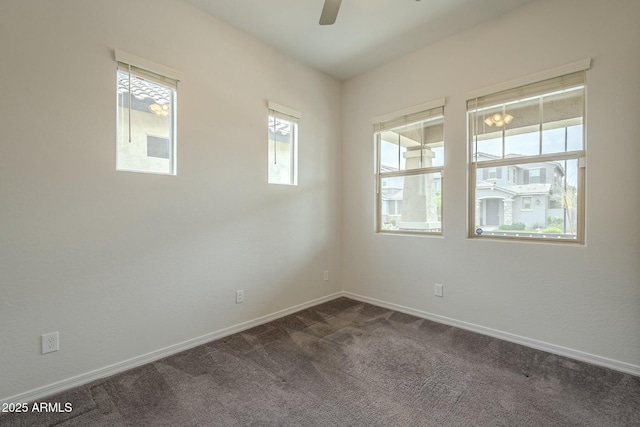 4090 E Bethena St, Gilbert, AZ 85295 - empty room featuring baseboards, dark carpet, and a ceiling fan
