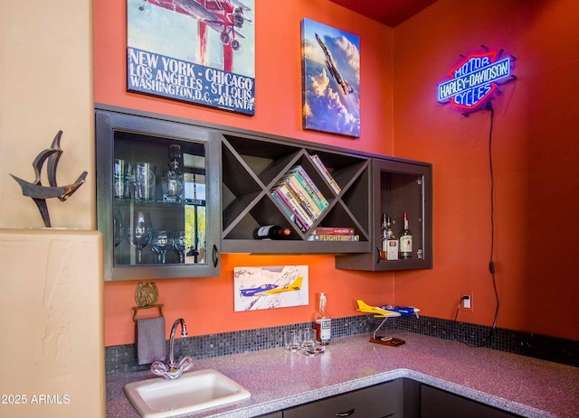 bar featuring a sink and bar area