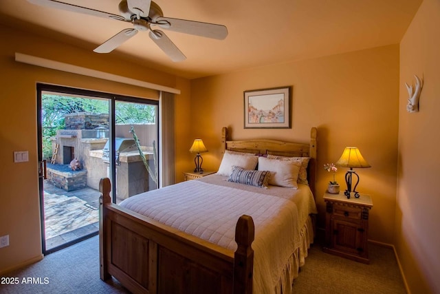 carpeted bedroom featuring access to outside, a ceiling fan, and baseboards