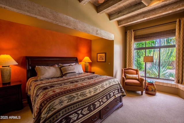bedroom featuring beamed ceiling and carpet