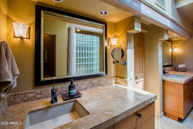 full bath featuring visible vents, decorative backsplash, and vanity