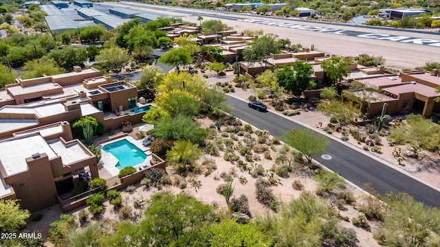 birds eye view of property with a residential view