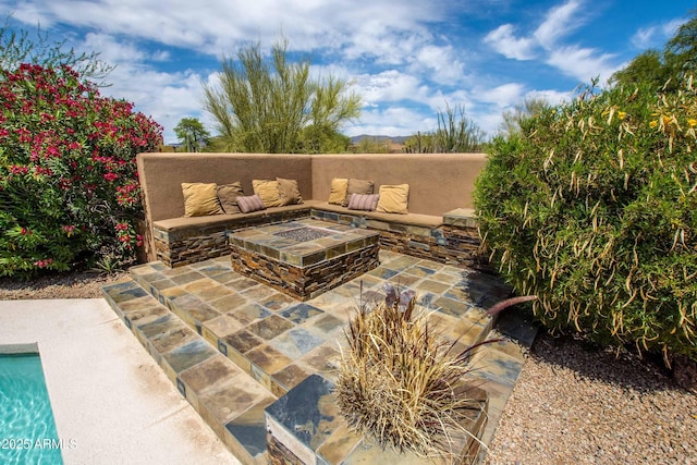 view of patio / terrace featuring a fire pit