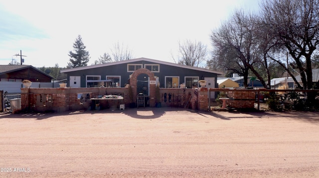 view of front of property featuring fence