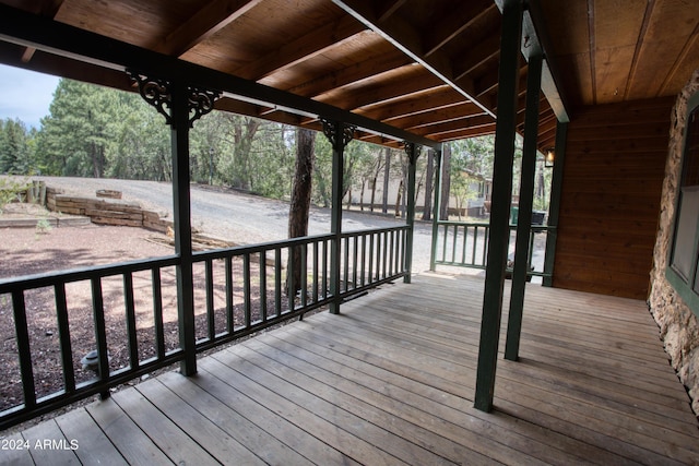 wooden deck with a water view