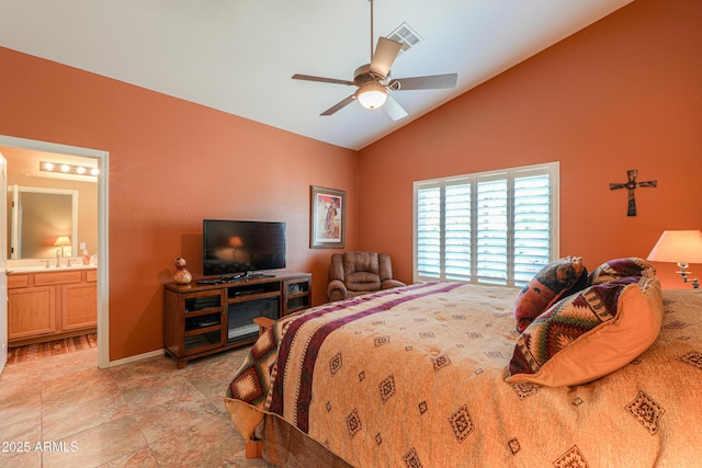 bedroom featuring visible vents, baseboards, a ceiling fan, lofted ceiling, and a sink