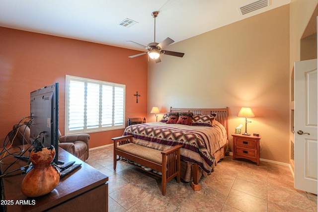 bedroom with a ceiling fan, visible vents, baseboards, and light tile patterned flooring