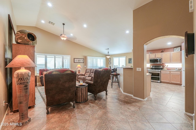 living room featuring arched walkways, high vaulted ceiling, light tile patterned flooring, recessed lighting, and visible vents