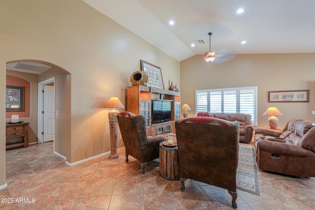 living area featuring arched walkways, recessed lighting, visible vents, and baseboards