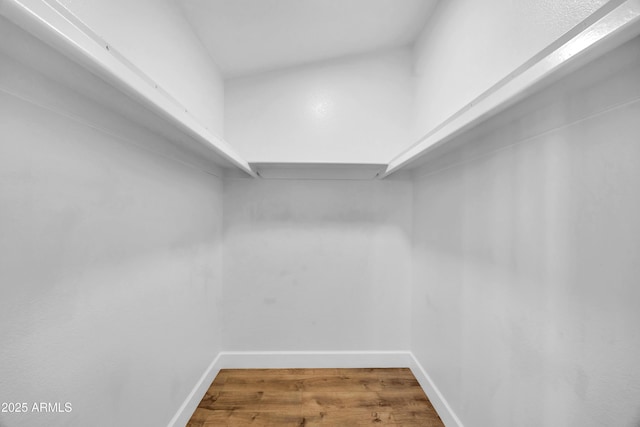 spacious closet with wood finished floors