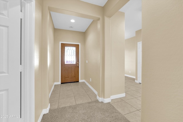 entryway with light tile patterned floors