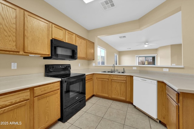 kitchen featuring black appliances, sink, light tile patterned floors, ceiling fan, and kitchen peninsula