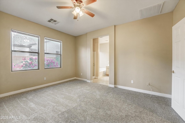 unfurnished room featuring light colored carpet and ceiling fan