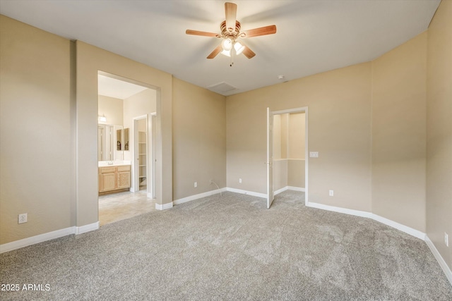 carpeted empty room featuring ceiling fan