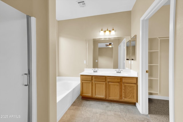 bathroom with ceiling fan, vanity, and separate shower and tub