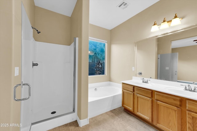 bathroom with vanity and separate shower and tub