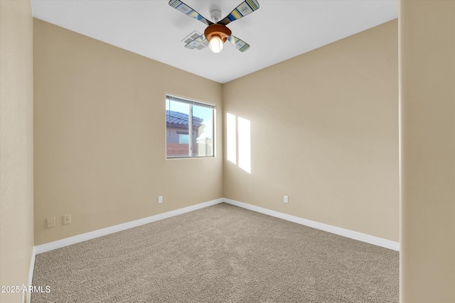 empty room featuring carpet floors and ceiling fan